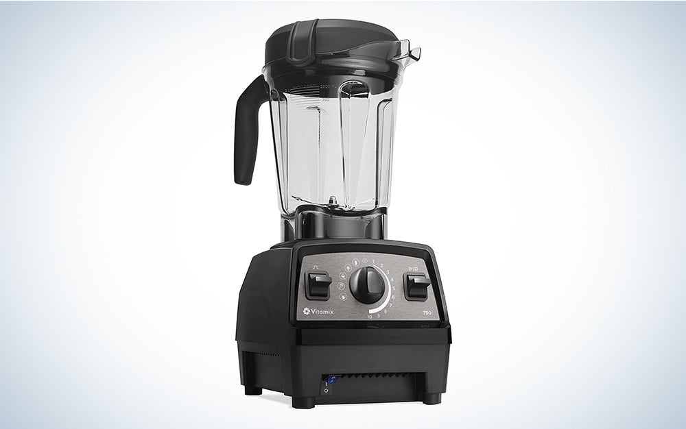 A Vitamix 750 blender on a blue and white background